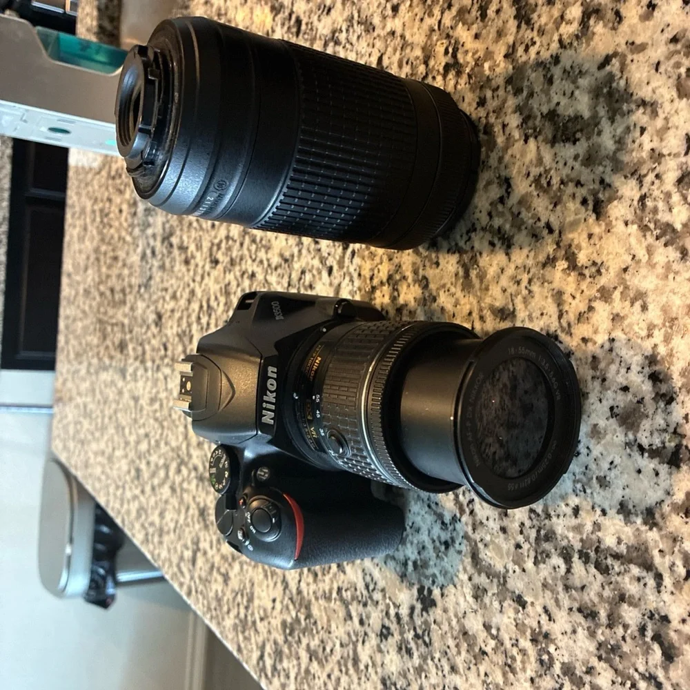 Nikon Black Digital Camera with Ergonomic Design and Professional Lens